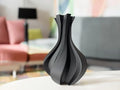 Vase Volute noir exposé dans un salon