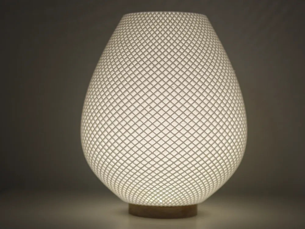 Vue rapprochée du luminaire Résille présenté allumé