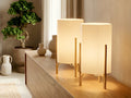Deux luminaires Sérénité présentés sur une commode dans un intérieur lumineux